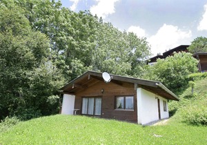 Quaint Chalet with Garden, Terrace, Fireplace,Play Equipment