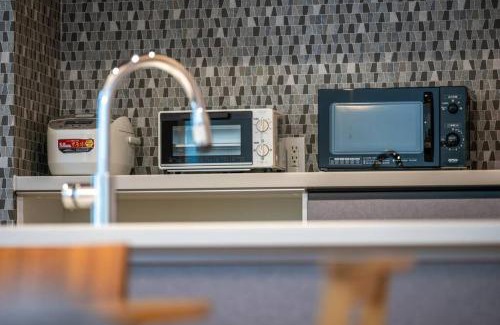 Toyohira Villa | 新屋 札幌市中心薄野車程5分鐘 挑高設計客廳 可停車1台 高速Wi Fi 地鐵徒步5分 一站到薄野