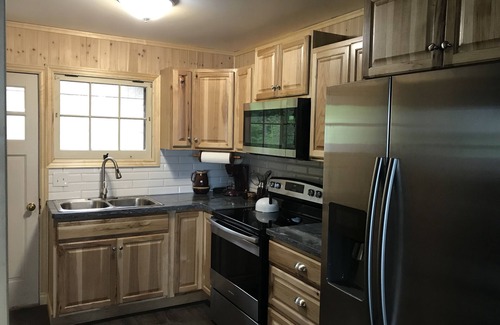 Bear Lake Cottage | 100' Prime Lakefront w/sandy lake bottom - updated cottage w/dock/boats/bikes