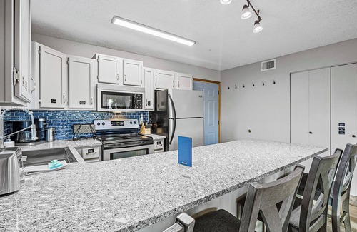 Village of Four Seasons Condo | 1st-floor condo with lake-view deck + on-site pools & hot tub