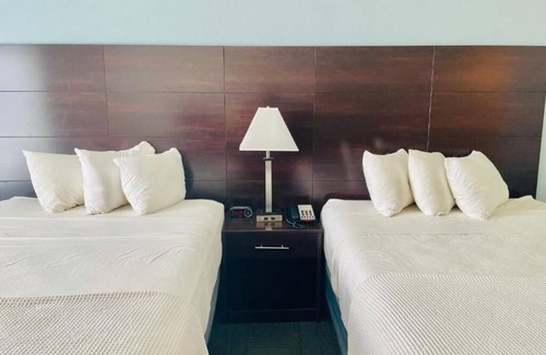 Cuero House | 2 Double Queen Rooms at FairBridge Inn & Suites Cuero, Pets Are Welcome!