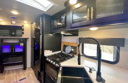 Medford House | 2 separate RV’s with queen-sized beds, dining area, and full kitchen.