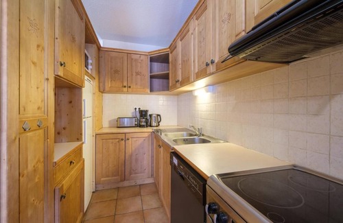 Lanslevillard Apartment | 200m from resort center, swimming pool, sauna, hammam, balcony, fireplace or stove, parking, tv