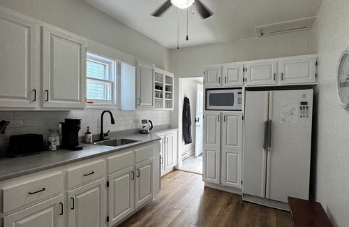 North End House | 2025 Renovated, bright/spacious main floor unit. Private driveway and backyard.