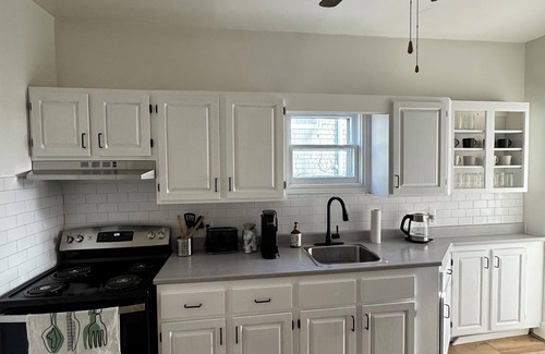 North End House | 2025 Renovated, bright/spacious main floor unit. Private driveway and backyard.