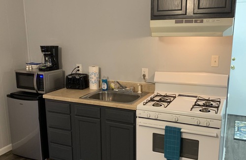 Summerlee Apartment | 215 Studio style room with king bed suitable for 2 adults. Free parking.