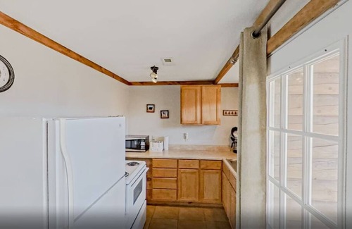 Indian Point Condo | 2BR Waterfront Duplex Cabin w/Pool + Swim & Boat dock