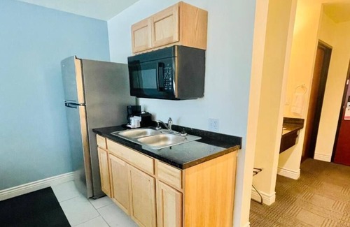 Cuero House | 3 Double Queen With Kitchenette at FairBridge Inn & Suites Cuero, Pet-Friendly!