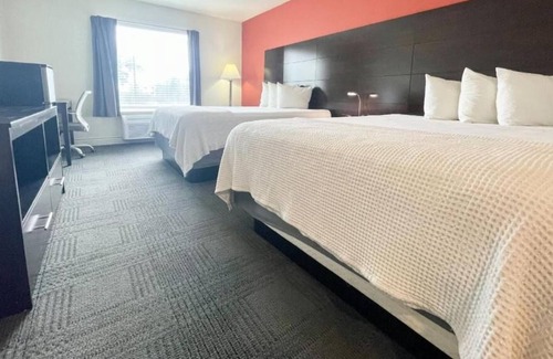 Cuero House | 3 Double Queen With Kitchenette at FairBridge Inn & Suites Cuero, Pet-Friendly!