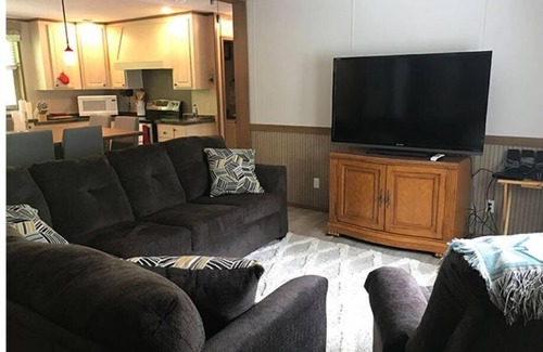 Lejunior Cabin | 3BR, 2 Bath house with full kitchen, living room, and hot tub.