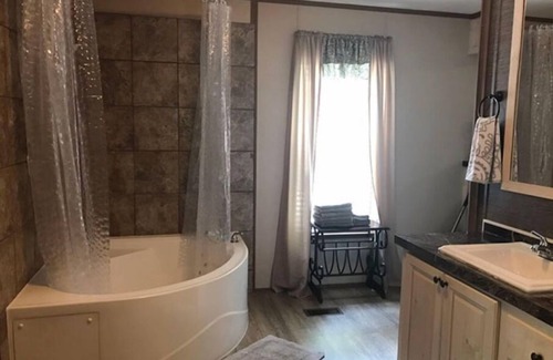 Lejunior Cabin | 3BR, 2 Bath house with full kitchen, living room, and hot tub.