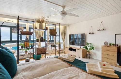 Ingenbohl Apartment | 4 Seasons Apartment I 1-4 Personen I See, Bergsicht I 65' Smart TV, Tischkicker und Badewanne I Parkplatz