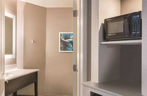 Orlando House | 4 x King Bed Deluxe Suite, Pool View at La Quinta Inn by Wyndham Orlando UCF