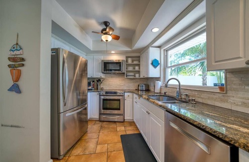 Indian Rocks Beach House | 456 Waterfront w/Dock, 3/Br Home Heated pool with Golf Cart in IRB Sleeps 10