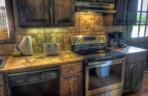 Sabinal Cabin | 6-bedroom Lodge on 12 acres in Concan, Texas. Swimming pool & hot tub.