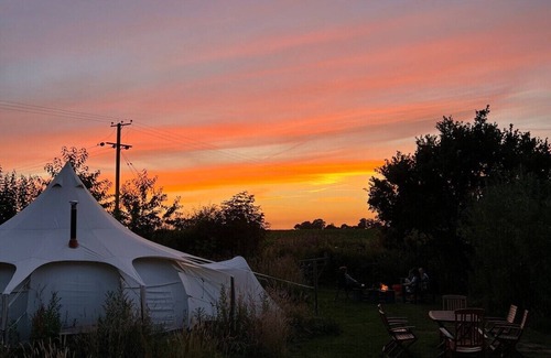 Haveringland RV Rental | 6m Unfurnished tent next to Natural pool