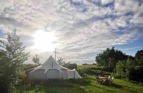 Haveringland RV Rental | 6m Unfurnished tent next to Natural pool
