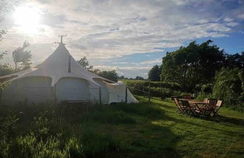 Haveringland RV Rental | 6m Unfurnished tent next to Natural pool