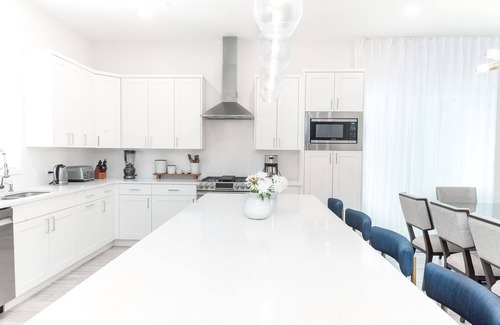 West Bay Condo | 7 Mile Beach Beach Club and Pool Pavilion. Ocean views from Roof Terrace