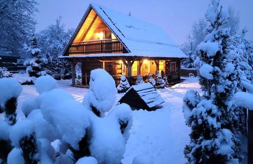Raba Wyzna House | A beautiful wooden house with a sauna and jacuzzi and a large garden.