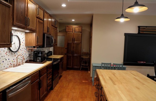 Oskaloosa Apartment | A Class-y & spacious 1500 square foot retreat in a century old brick schoolhouse