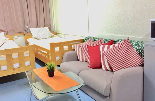 Higashinari Apartment | a room with two toilets and a shower