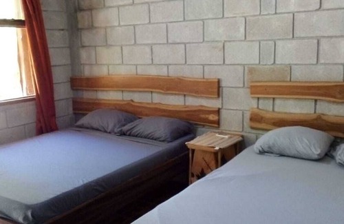 Marbella Cabin | A rustic lodge surrounded by garden, nestled in a jungle setting - double Room 1