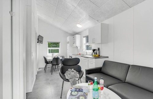 Assens House | A small cottage awaits you here, located on a campsite with a playground.