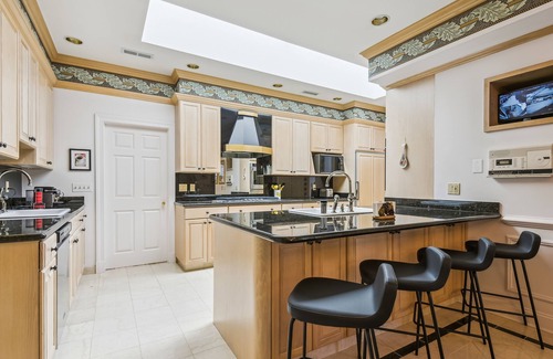 Downtown Baltimore Villa | A Villa Steps from Harbor East with Indoor Pool and 4-Car Parking Sleeps 12