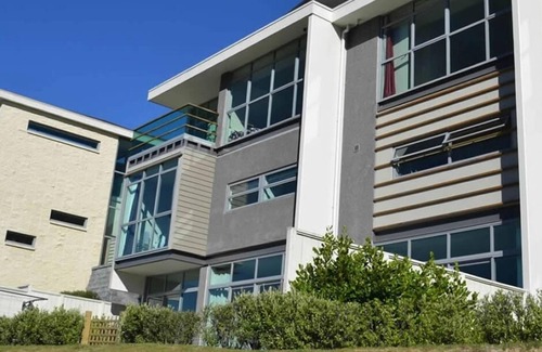 Taupo Apartment | Absolute waterfront apartment. Stunning river views. Swimming pool and kayaks.