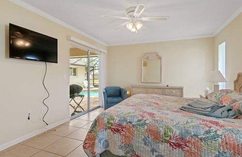 Pebble Beach House | ABSOLUTELY GORGEOUS CANAL HOME WITH HEATED INGROUND POOL ON A QUIET STREET!