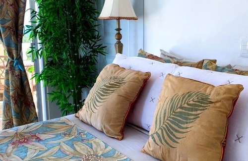 Cabrera Hotel | Adorable tropical room with a stunning balcony, pool, fire pit, gardens, & more!