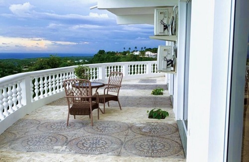 Cabrera Hotel | Adorable tropical room with a stunning balcony, pool, fire pit, gardens, & more!