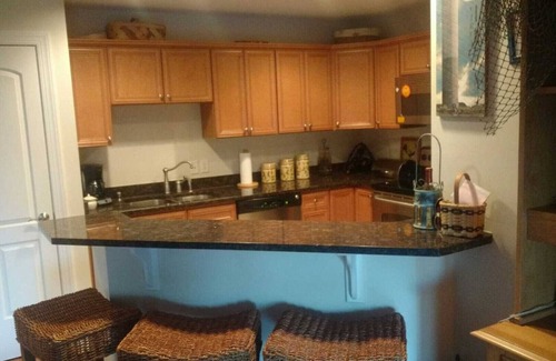 Yaupon Beach Condo | Adorable two bedroom beach condo with private beach, pool and hot tub