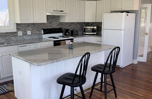 Mayo House | Adorable waterside cottage with pool Beach community