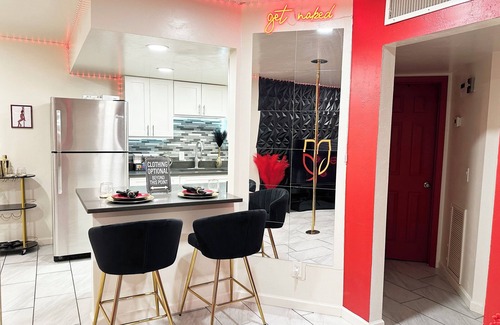 Tucson Apartment | Adult-only fantasy suite with hot tub, dance pole, and kink-inspired furniture. Perfect for couples craving privacy, intimacy, and play. Discreet, clean, and unforgettable—your private Red Chamber escape.
