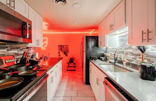 Tucson Apartment | Adult-only fantasy suite with hot tub, dance pole, and kink-inspired furniture. Perfect for couples craving privacy, intimacy, and play. Discreet, clean, and unforgettable—your private Red Chamber escape.