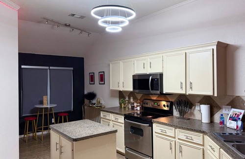 Killeen House | Adult-only kink-friendly getaway with Jacuzzi spa, king bed, custom play furniture, massage table, and LED mood lighting. Ideal for romantic escapes, adventurous weekends, or indulgent celebrations in total privacy.