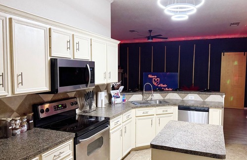 Killeen House | Adult-only kink-friendly getaway with Jacuzzi spa, king bed, custom play furniture, massage table, and LED mood lighting. Ideal for romantic escapes, adventurous weekends, or indulgent celebrations in total privacy.