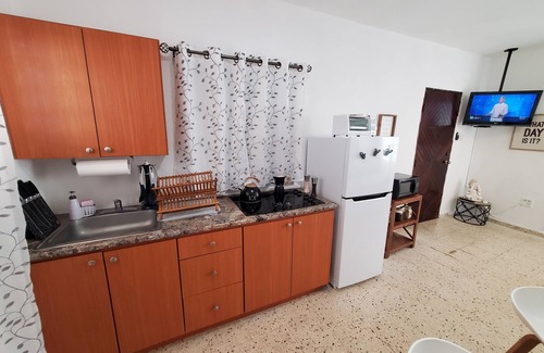 Borinquen Apartment | Aguadilla Surfers Lair Apt. with electricity,water A/C WIFI near Crashboat beach