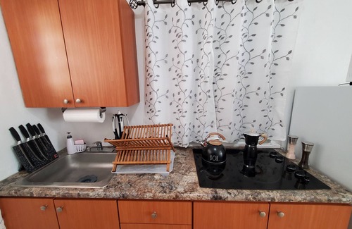 Borinquen Apartment | Aguadilla Surfers Lair Apt. with electricity,water A/C WIFI near Crashboat beach