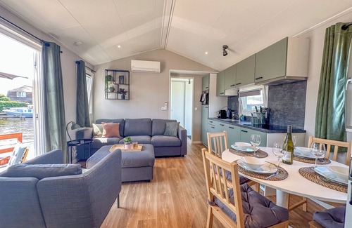 Municipality of Stichtse Vecht Boat Rental | Air-conditioned chalet with waterside terrace