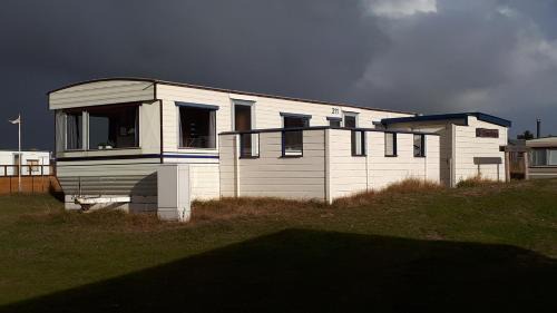Ballum House | AMELAND - Ballum: Stacaravan Chalet (incl. fietsen) bij strand en zee