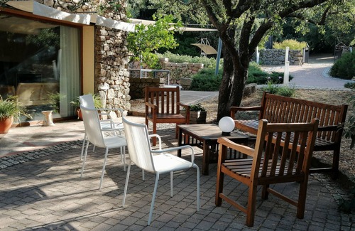 Aglientu Apartment | Apartment 'Barone Rampante' with Shared Pool, Private Garden and Air Conditioning