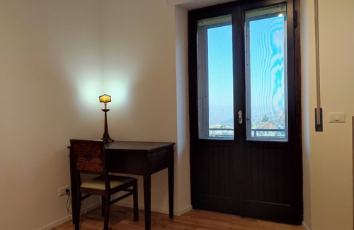 Fermo Apartment | Apartment 'Hoarder's Home Gallery' with Private Terrace, Private Garden and Air Conditioning