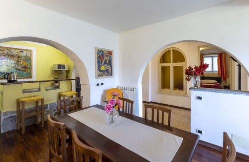 Carciano Ski Chalet | Apartment in stone chalet surrounded by greenery a few steps from the lake