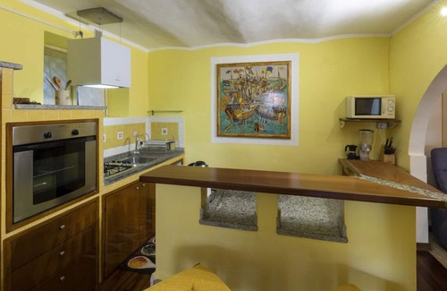 Carciano Ski Chalet | Apartment in stone chalet surrounded by greenery a few steps from the lake