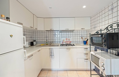 Bosa Historic Centre Apartment | Apartment 'La Residenza Color Del Mare' with Balcony, Wi-Fi and Air Conditioning