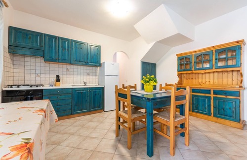 Porto Pino House | Apartment 'Oasi Blu Porto Pino' with Terrace, Garden & Wi-Fi