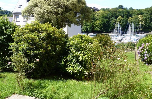 Douarnenez Apartment | apartment overlooking garden and sailboats